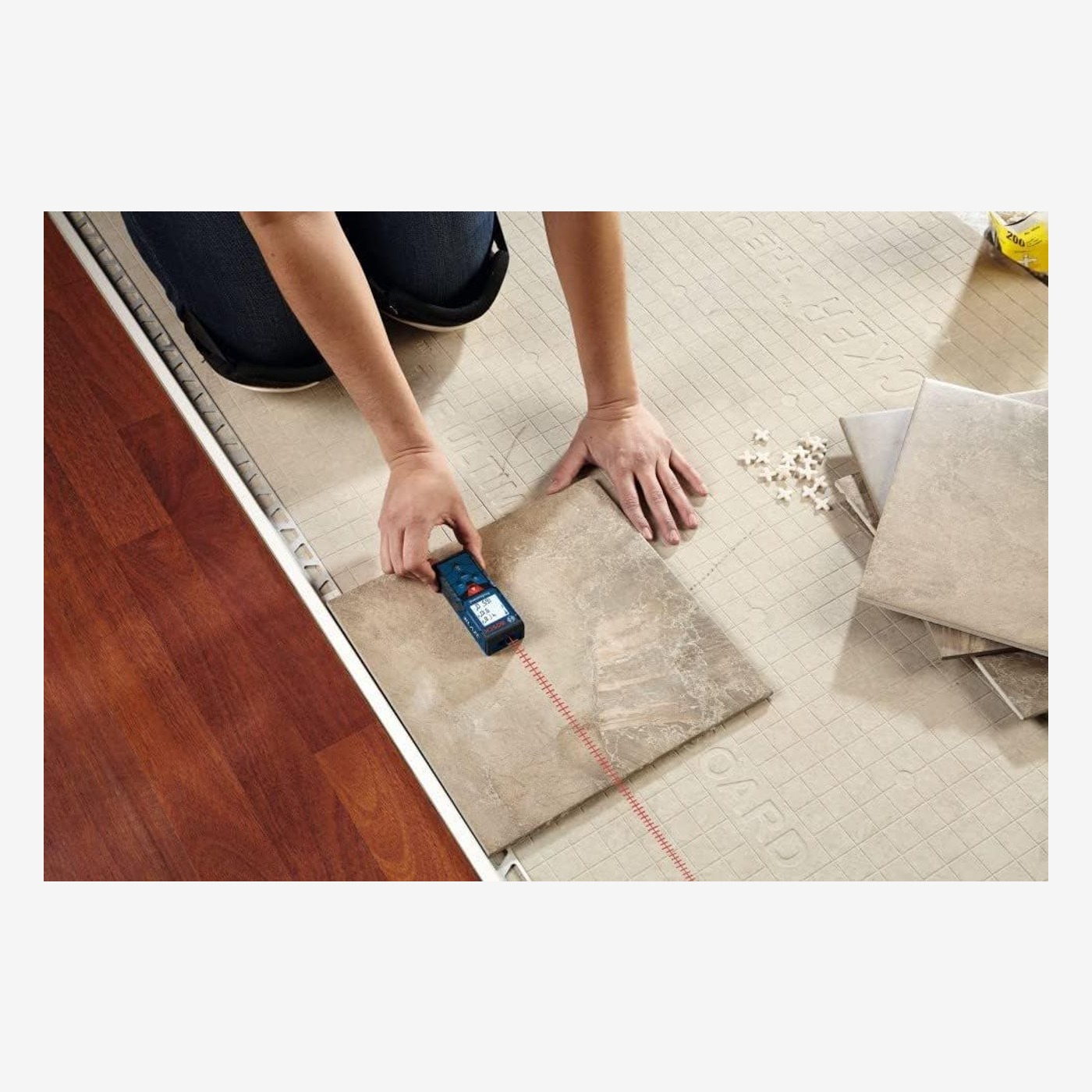 Bosch BLAZE GLM165-40 laser measure used while laying floor tiles